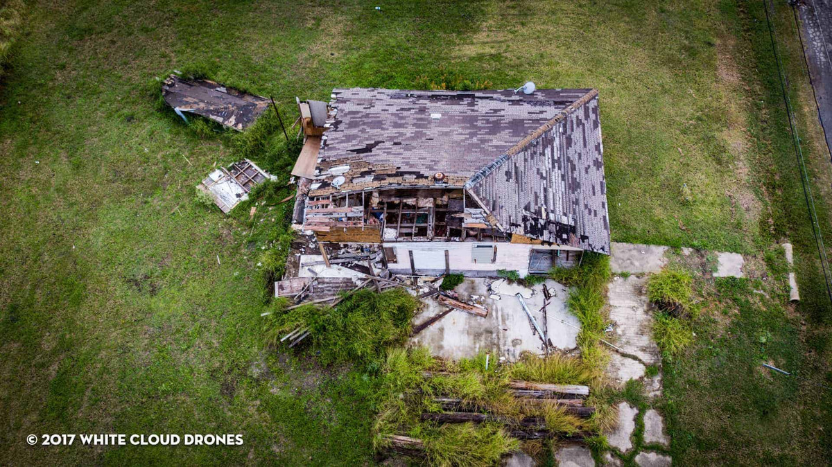 Arial view of a home damaged by hurricane Katrina