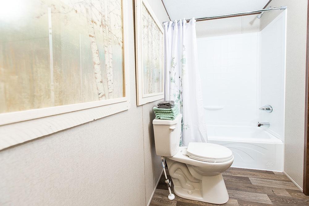Tru Homes Delight model mobile home primary bathroom