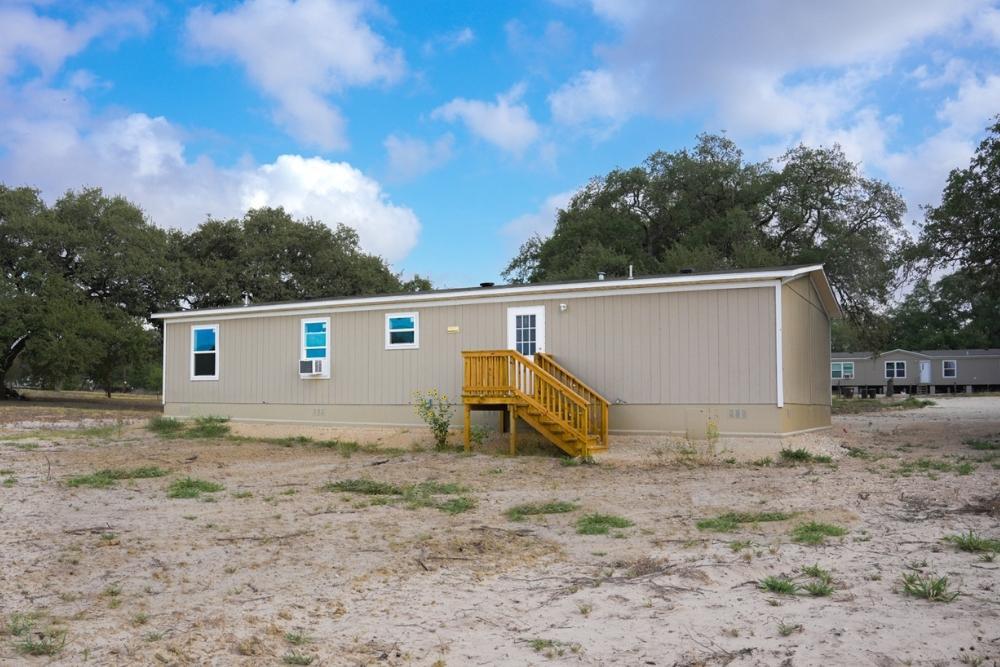 TRU Homes Double Wide Mobile Home Triumph Exterior Back View 01