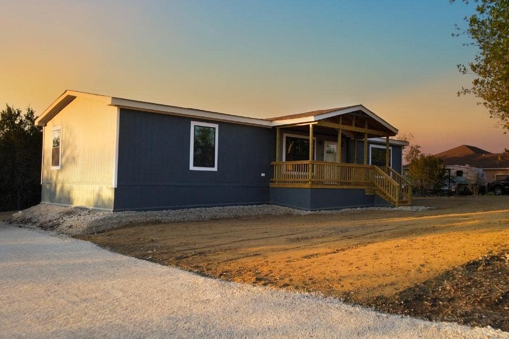Double wide mobile home with front porch on beautiful land