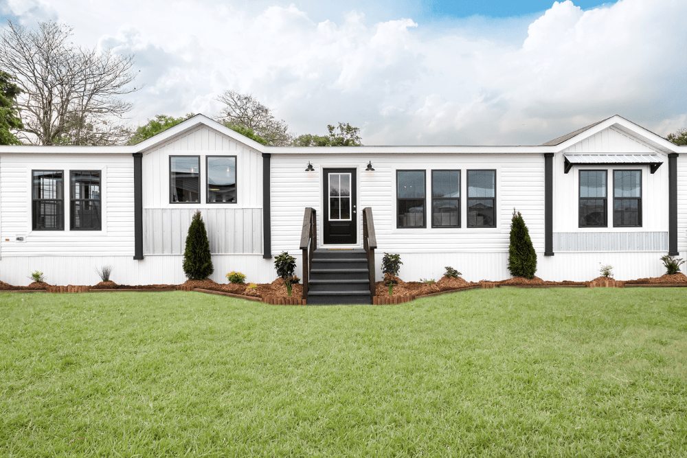 beautiful low-maintenance landscaping outside of mobile home